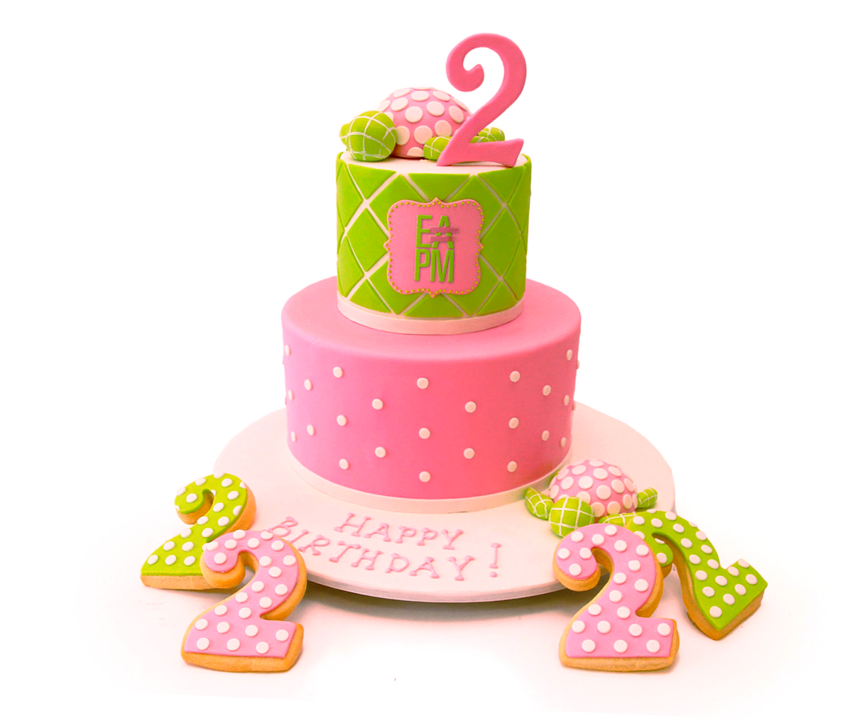 A pink and green two-tiered birthday cake with the EAPM logo and cookies in the shape of the number two